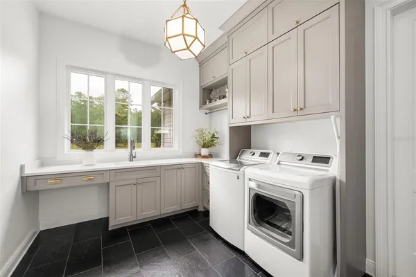 a view of a patio with swimming pool table and chairs