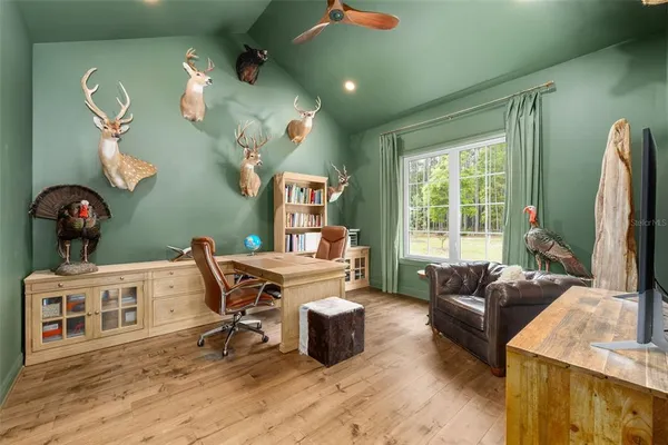 a view of a house with swimming pool and sitting area