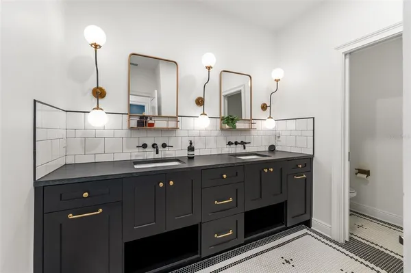 a view of a house with swimming pool and sitting area