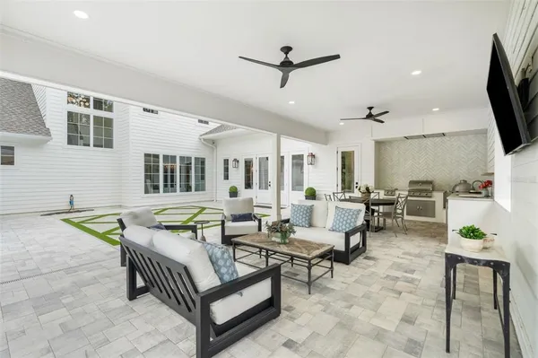 a front view of a house with a garden and porch