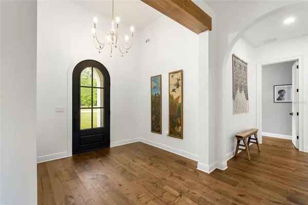 a view of livingroom with hardwood floor and hallway
