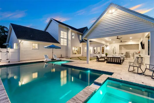 a view of a backyard with chairs