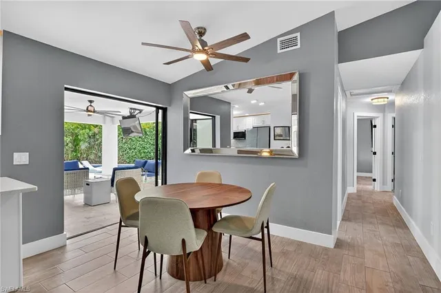 a dining room with furniture and window