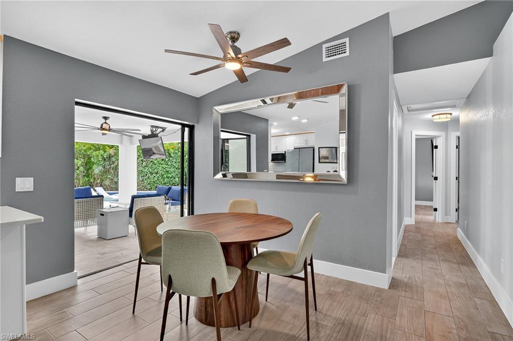 5270 Berkeley Drive Naples, FL 34112 - Photo 11 of 43 a dining room with furniture and window