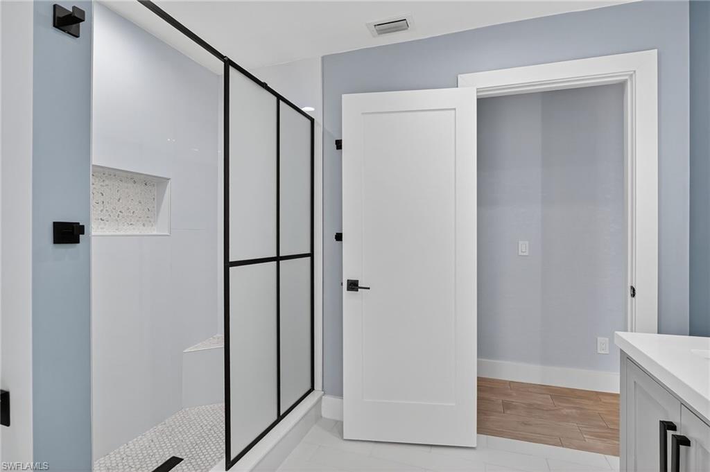 5270 Berkeley Drive Naples, FL 34112 - Photo 25 of 43 a view of elevator with hallway