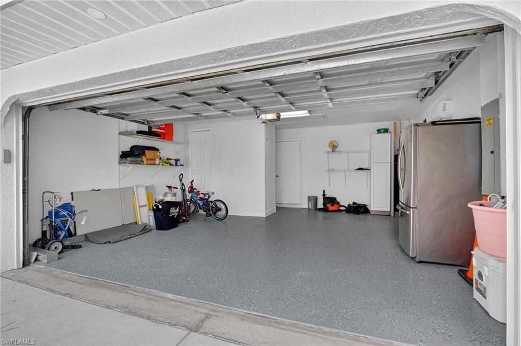 5270 Berkeley Drive Naples, FL 34112 - Photo 36 of 43 a view of a garage with storage