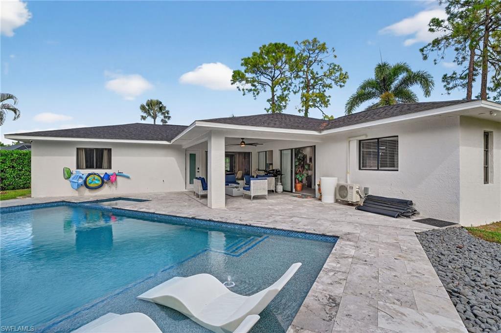 5270 Berkeley Drive Naples, FL 34112 - Photo 37 of 43 a view of a house with swimming pool