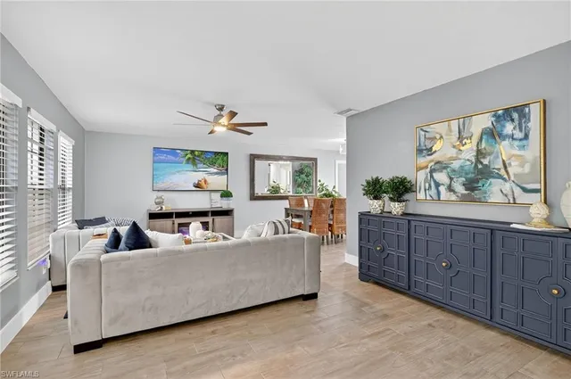 a living room with furniture and a window