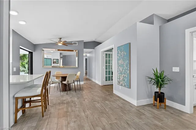 a view of a livingroom with furniture window and wooden floor