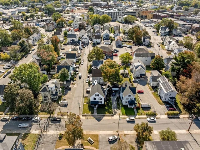 a view of a house with a mountain in the background