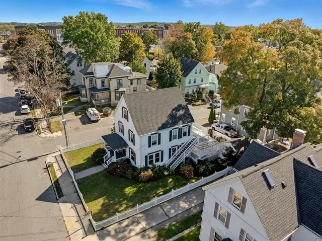 an aerial view of residential houses with outdoor space