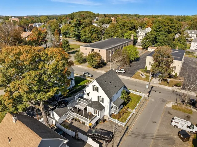 an aerial view of residential houses with outdoor space