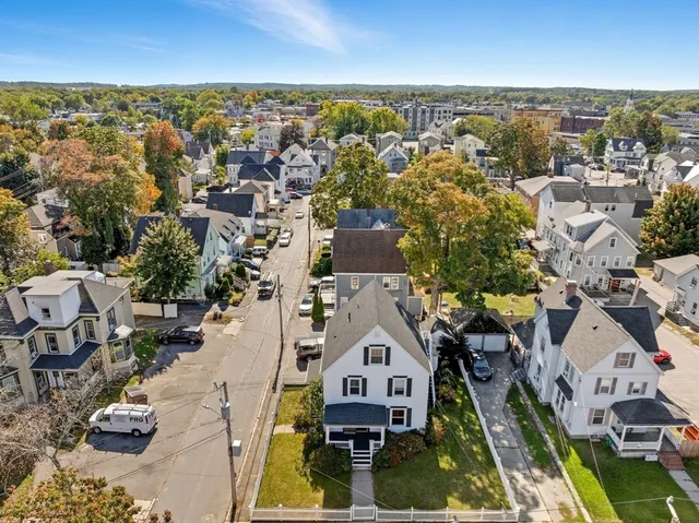 a kitchen with stainless steel appliances granite countertop a refrigerator a sink and a stove