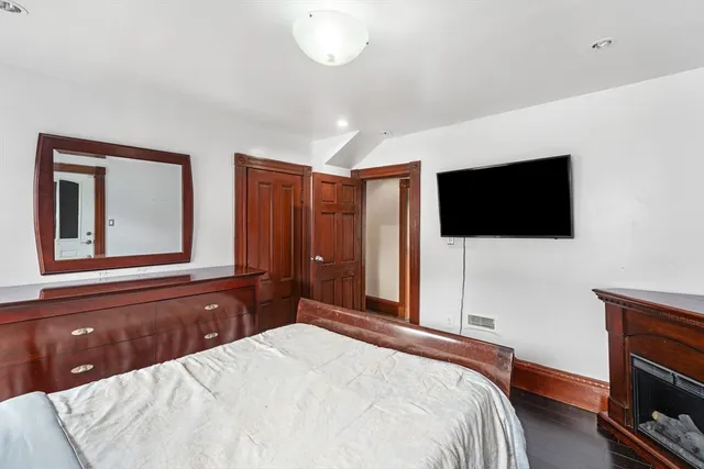 a view of entryway with wooden floor and stairs