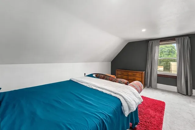 a view of entryway livingroom and hall with wooden floor