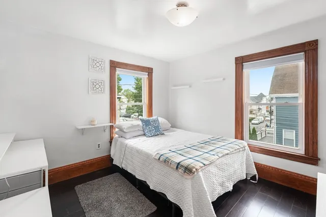 a view of workspace with wooden floor and furniture