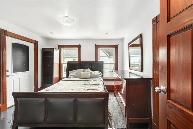 a kitchen with granite countertop kitchen island wooden cabinets and stainless steel appliances