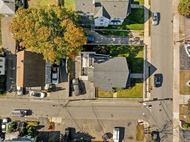an aerial view of residential houses with outdoor space