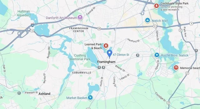 a white bath tub sitting next to a white wall