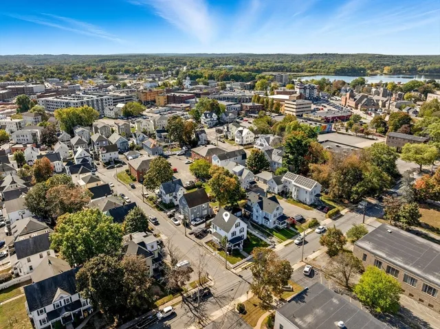 a living room with furniture fireplace and flat screen tv