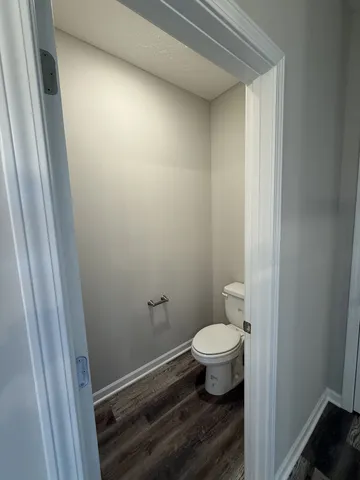 a bathroom with a toilet and a sink