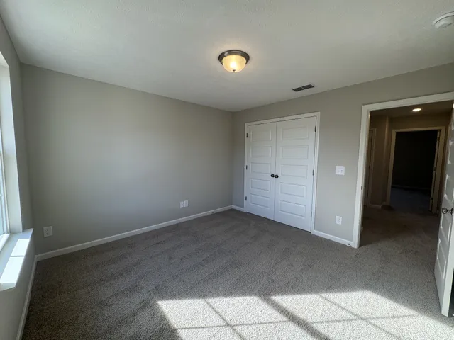 wooden floor and window in an empty room