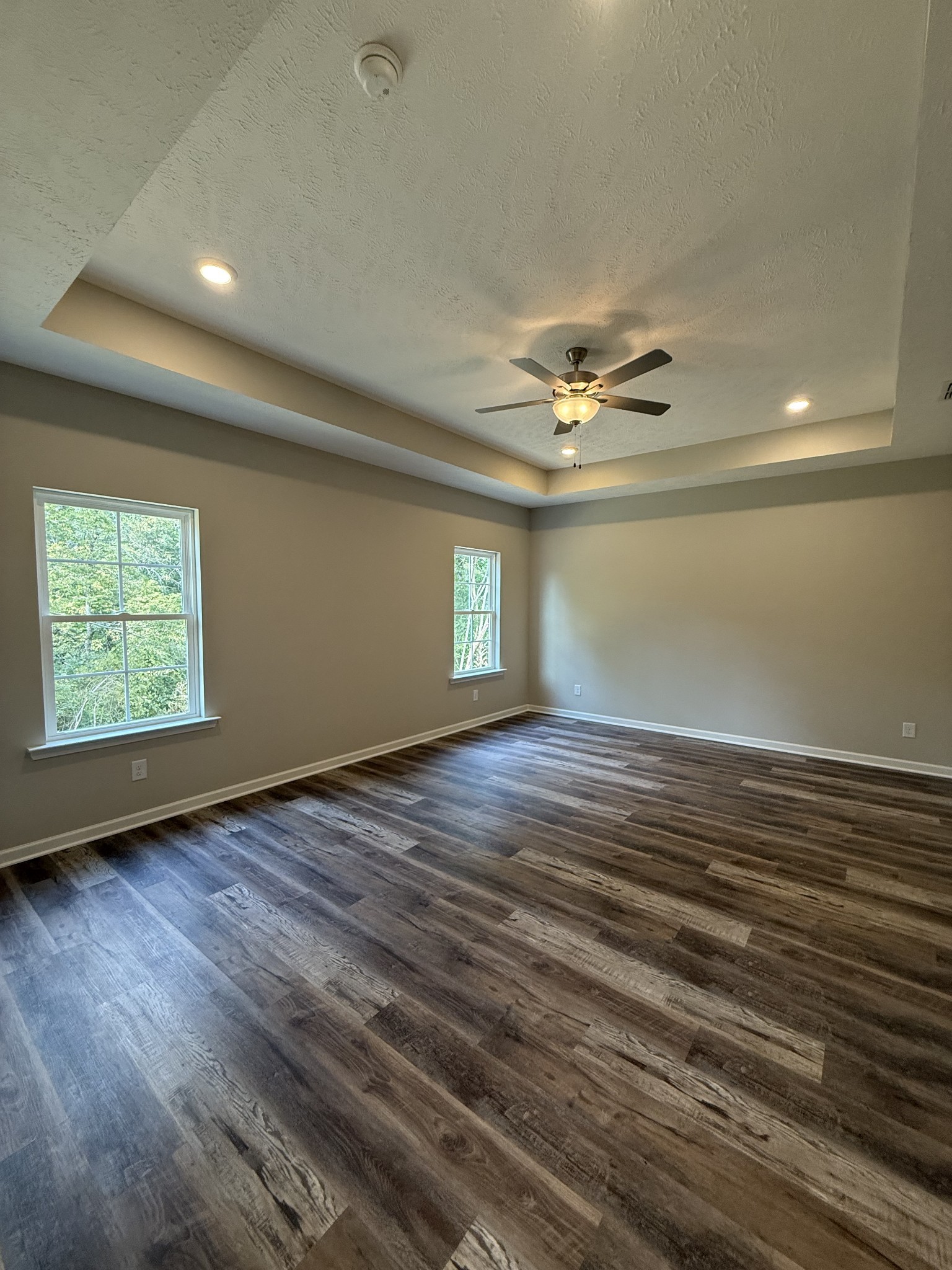 31 Spring House Drive Manchester, TN 37355 - Photo 16 of 32 an empty room with wooden floor and windows