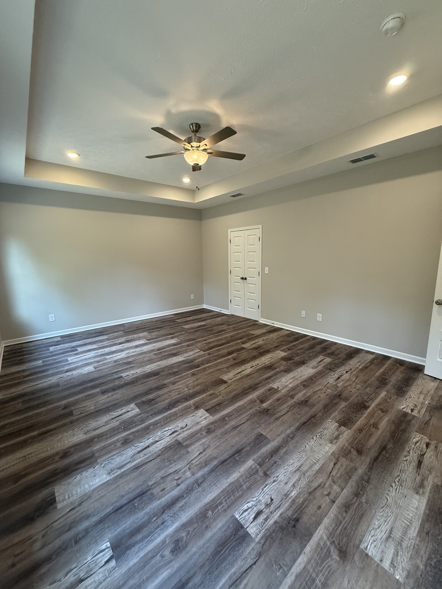 31 Spring House Drive Manchester, TN 37355 - Photo 17 of 32 an empty room with wooden floor and ceiling fan