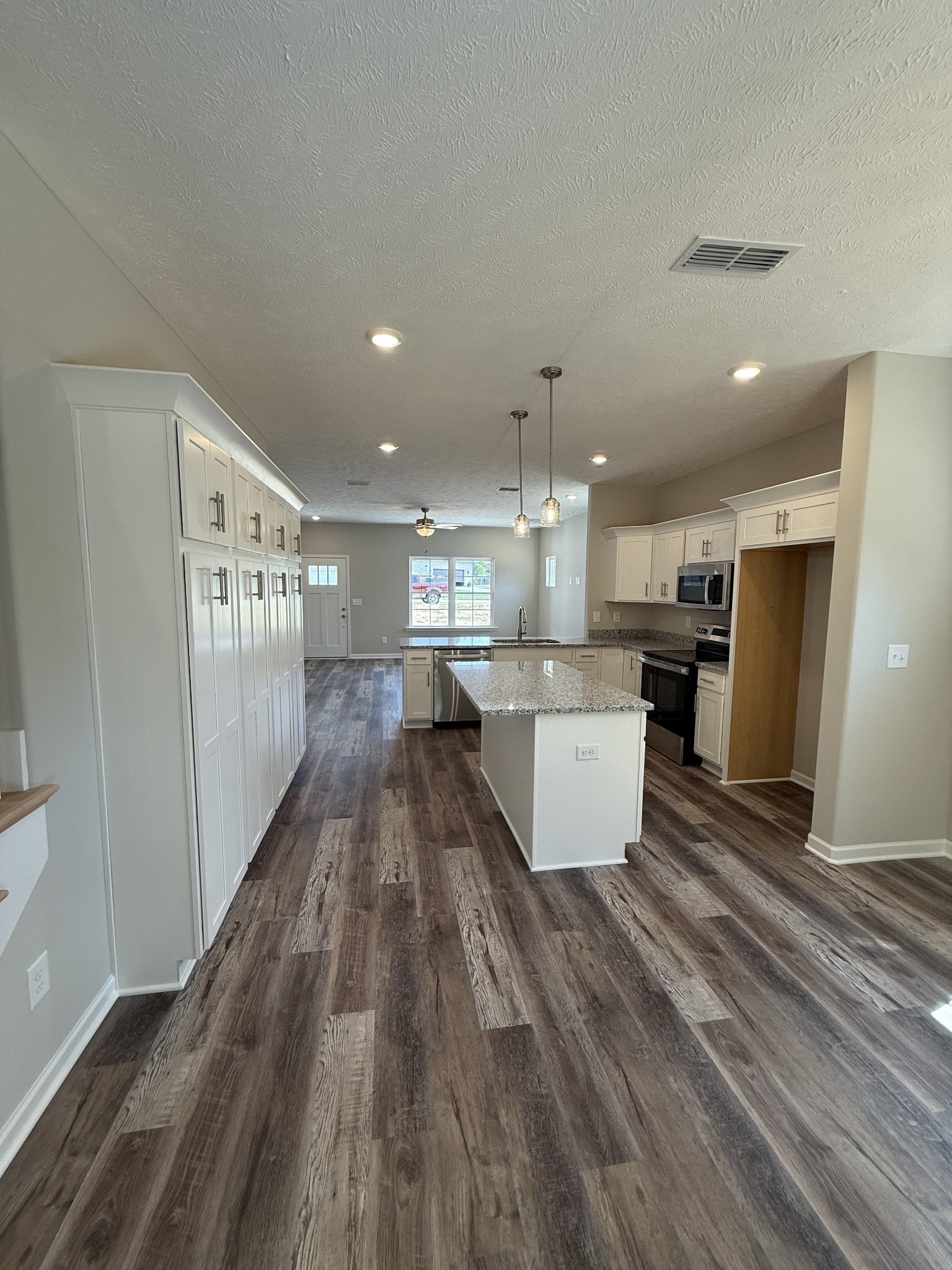31 Spring House Drive Manchester, TN 37355 - Photo 19 of 32 a view of kitchen with kitchen island wooden floor center island and stainless steel appliances