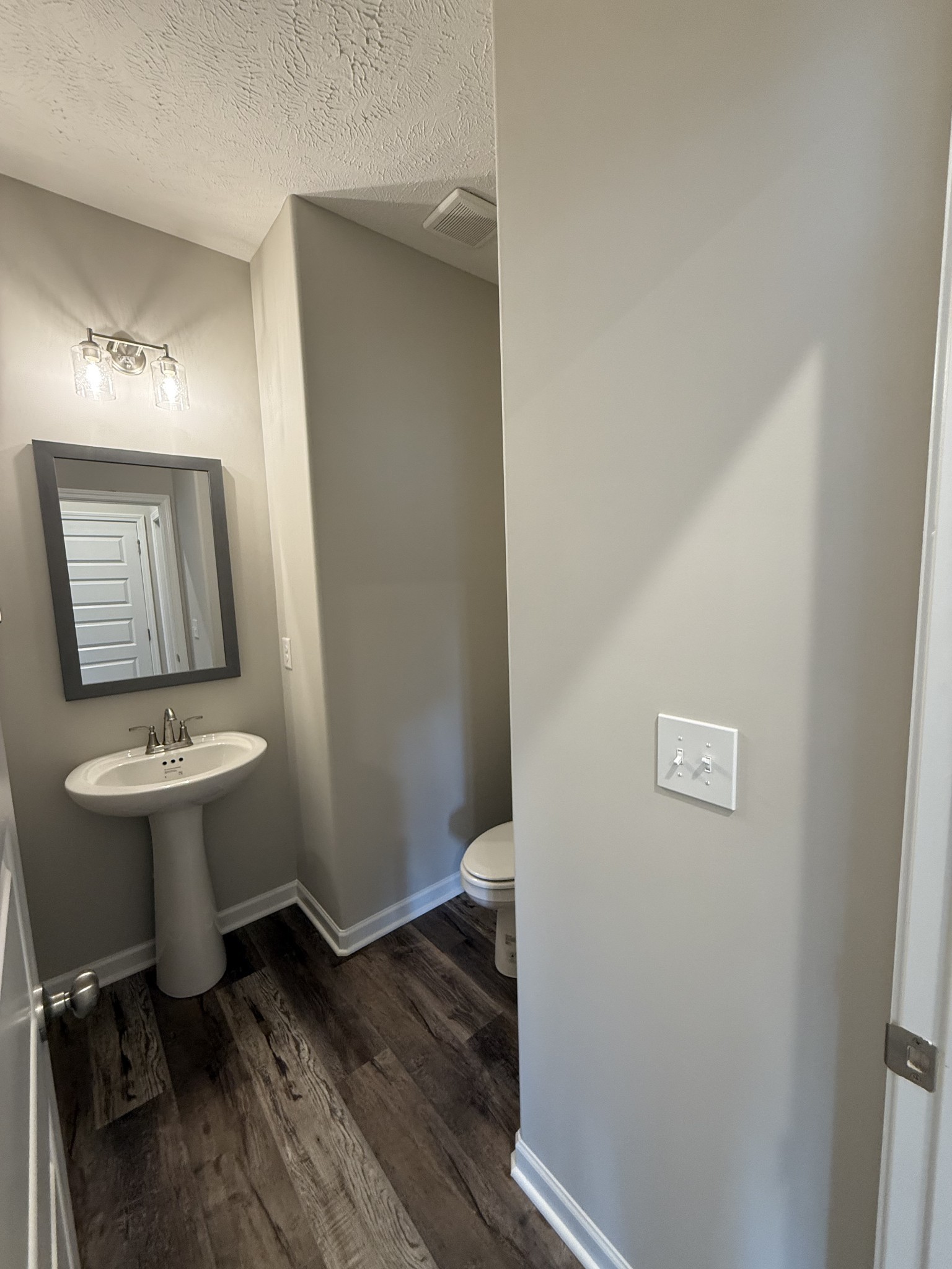 31 Spring House Drive Manchester, TN 37355 - Photo 8 of 32 a bathroom with a sink a toilet and mirror