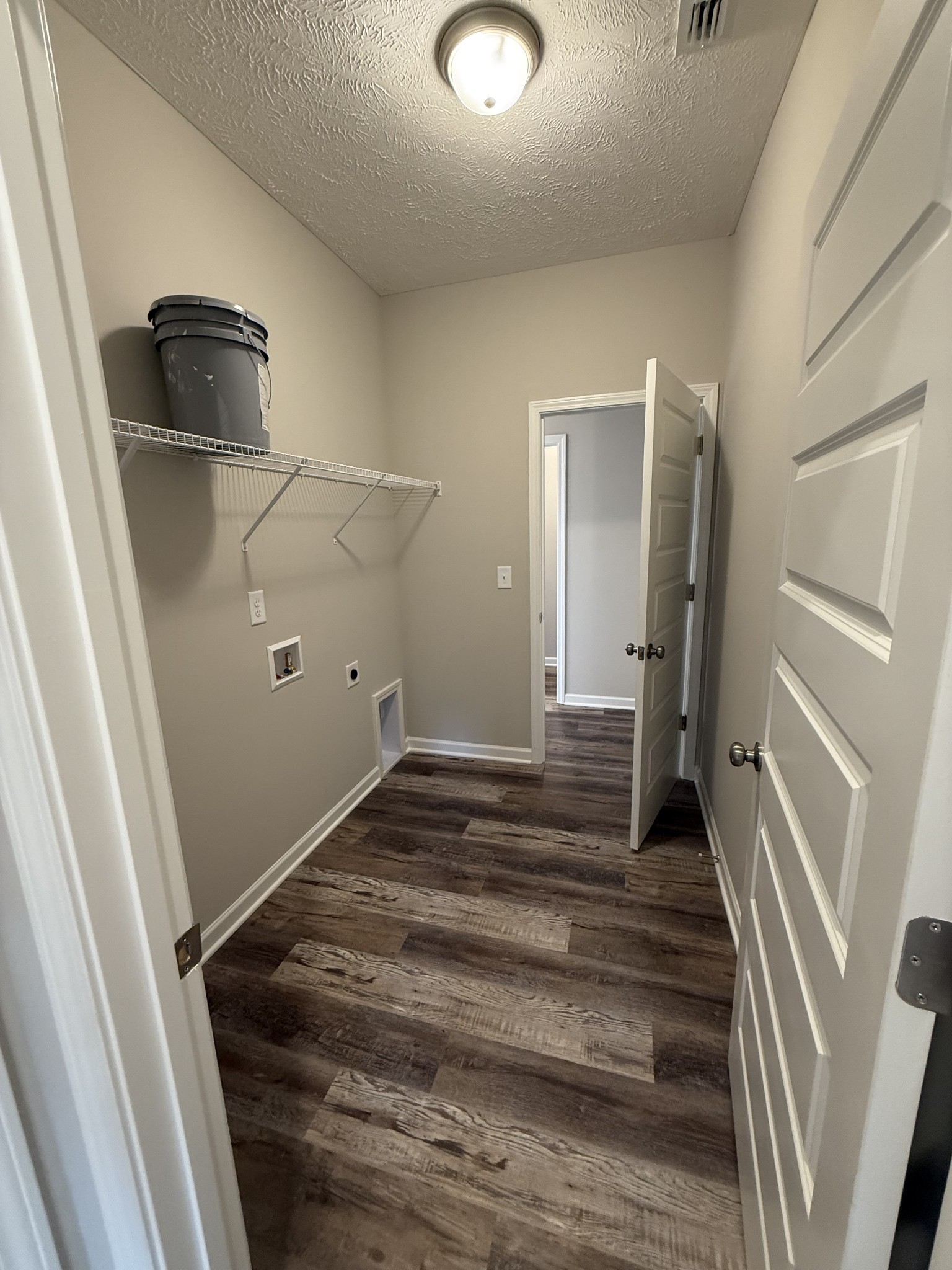 31 Spring House Drive Manchester, TN 37355 - Photo 9 of 32 a view of a hallway with wooden floor and staircase