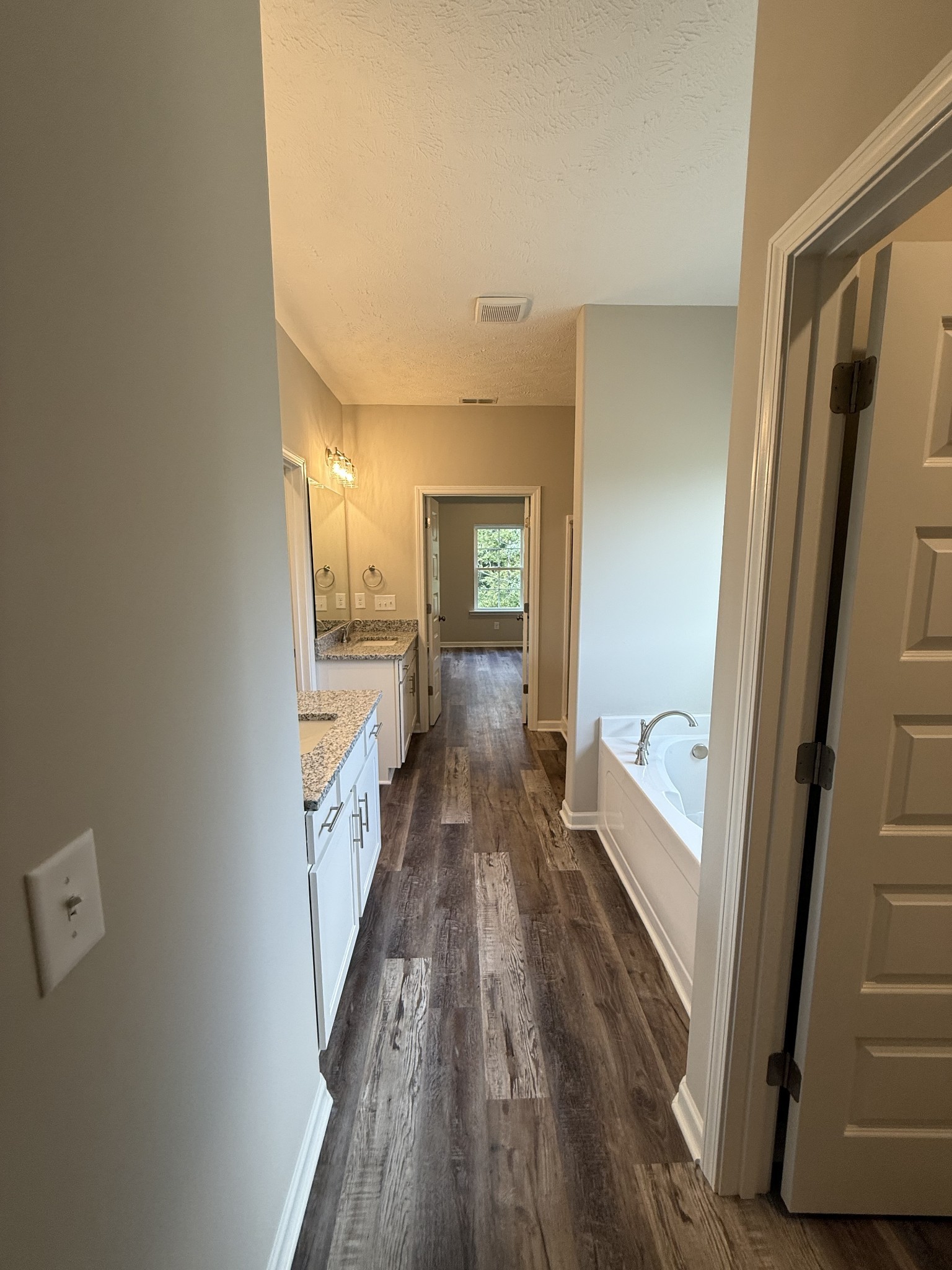 31 Spring House Drive Manchester, TN 37355 - Photo 10 of 32 a view of a hallway view with wooden floor and staircase