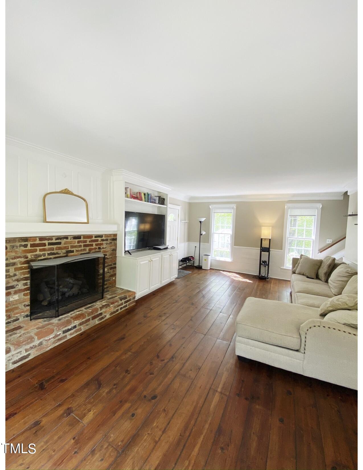 2000 Cayuga Place Raleigh, NC 27612 - Photo 11 of 31 a living room with furniture and a fireplace