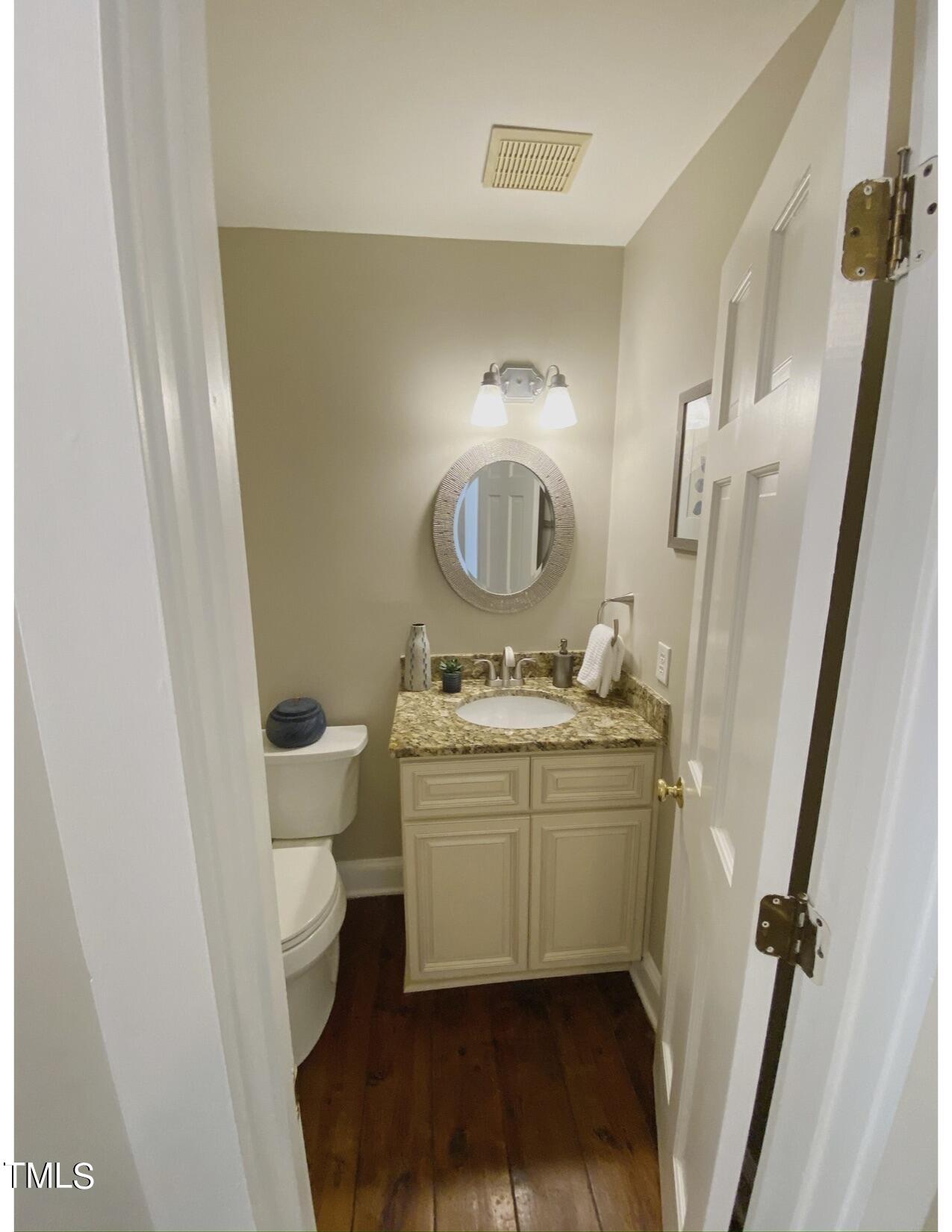 2000 Cayuga Place Raleigh, NC 27612 - Photo 17 of 31 a bathroom with a granite countertop sink toilet and shower