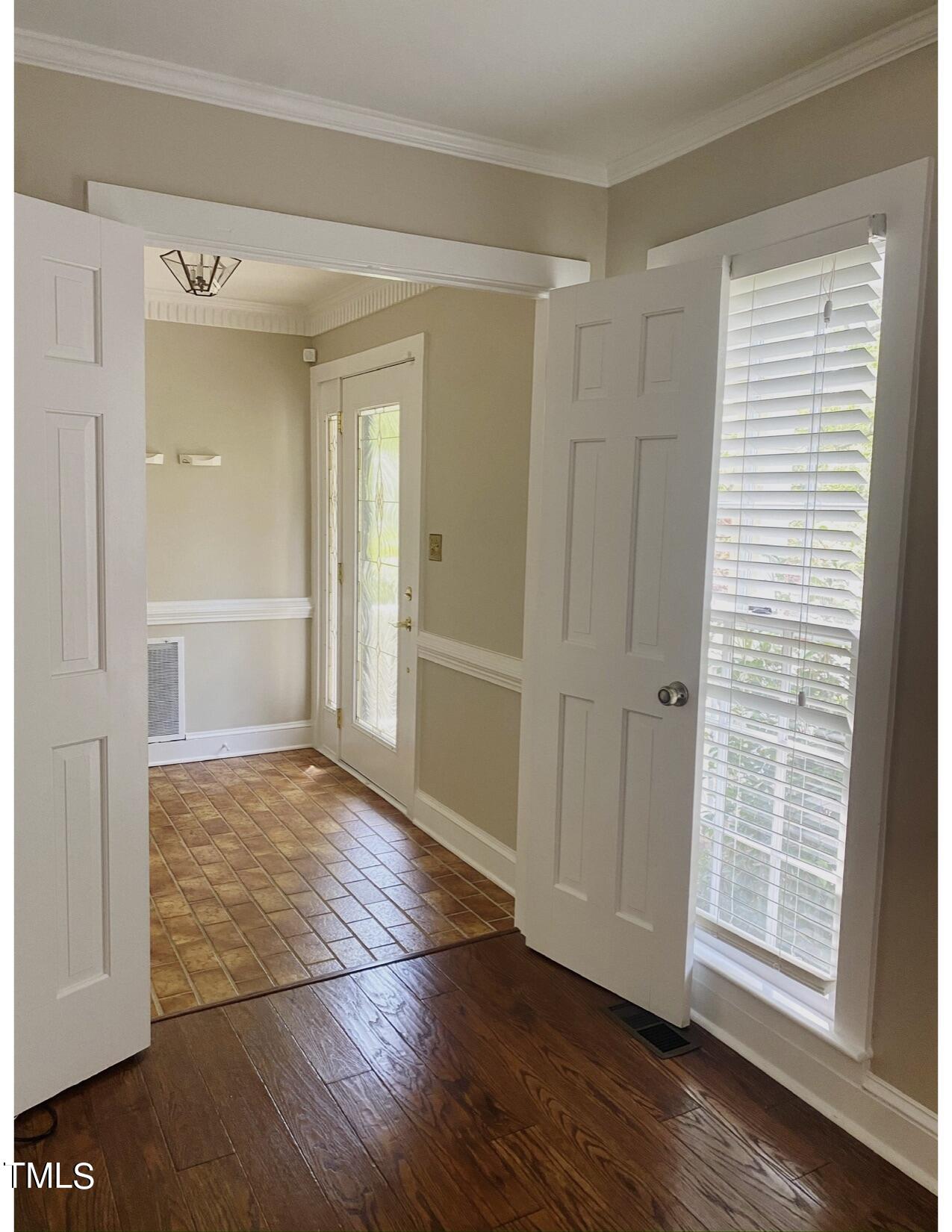 2000 Cayuga Place Raleigh, NC 27612 - Photo 18 of 31 a view of an empty room with wooden floor and a window