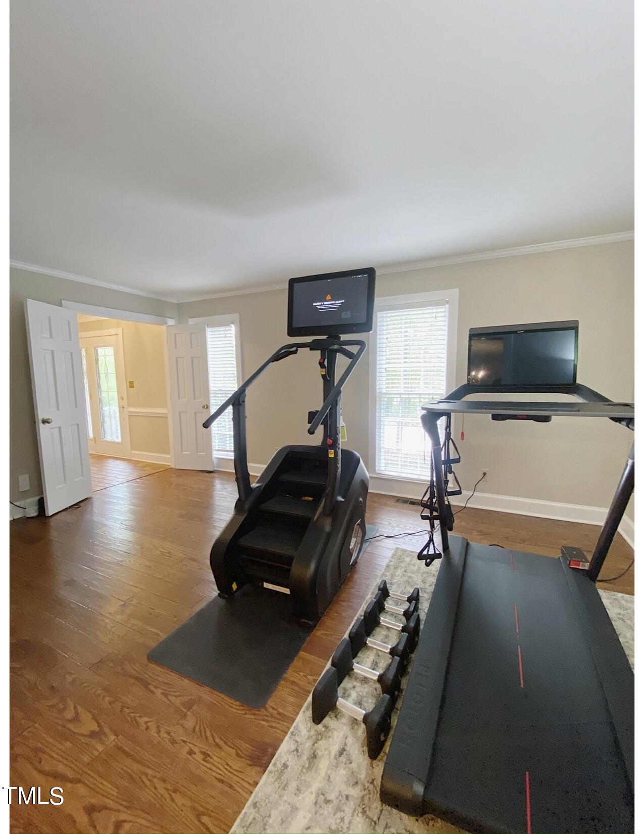 2000 Cayuga Place Raleigh, NC 27612 - Photo 21 of 31 a room with gym equipment and a mirror
