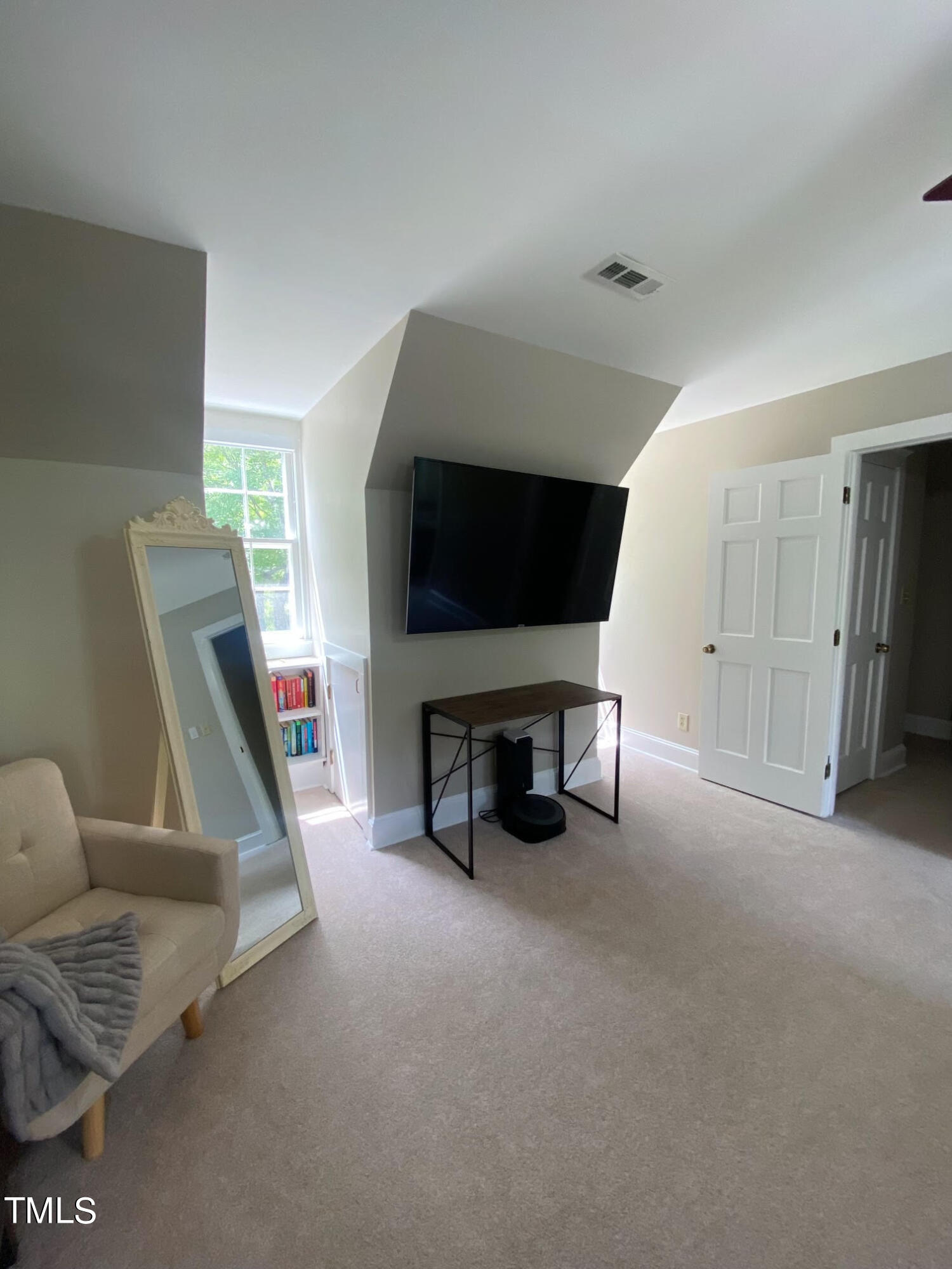 2000 Cayuga Place Raleigh, NC 27612 - Photo 23 of 31 a living room with furniture and a flat screen tv