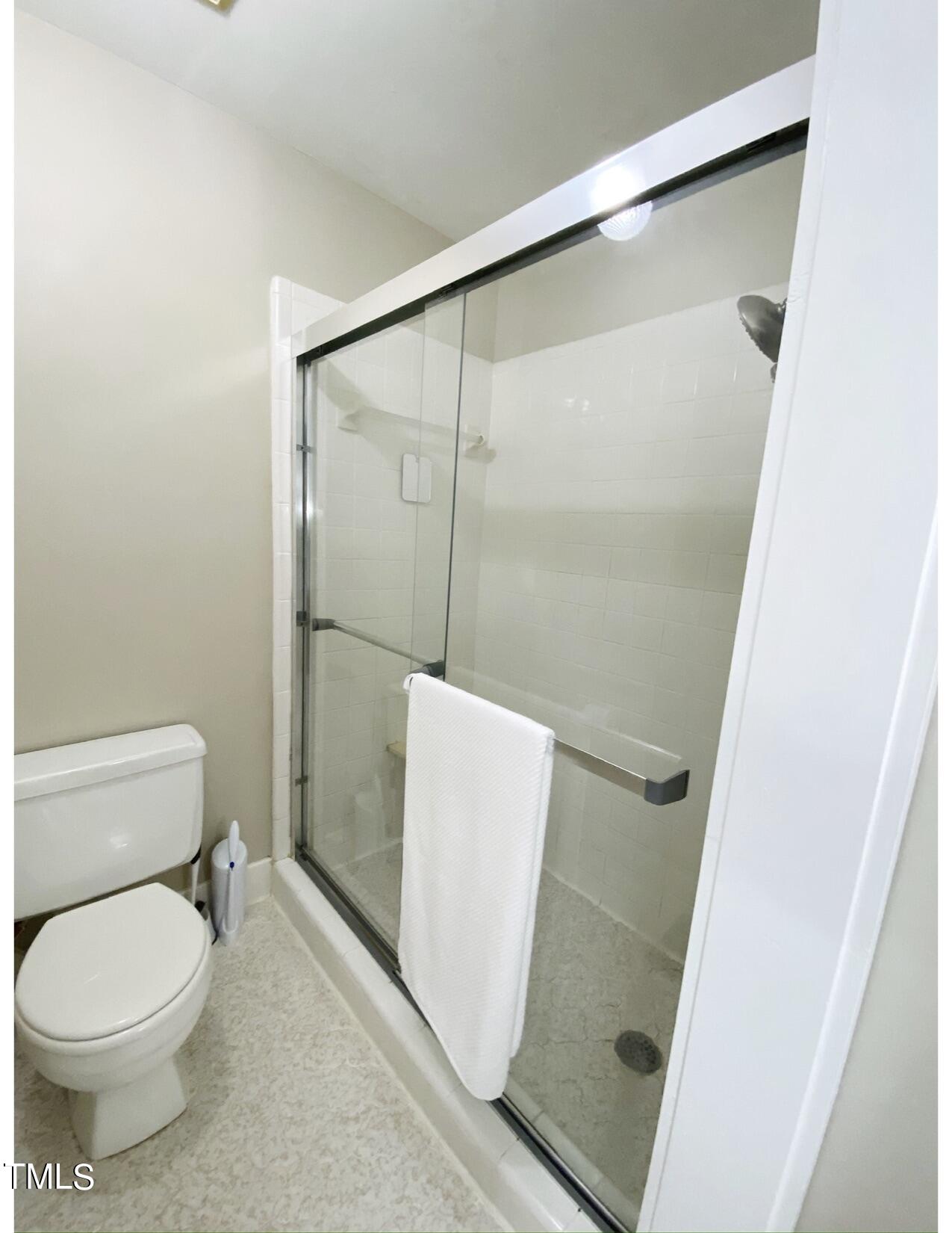 2000 Cayuga Place Raleigh, NC 27612 - Photo 26 of 31 a bathroom with a toilet and a shower