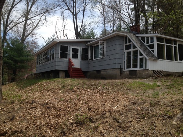 66 West Warren Road Ware, MA 01082 - Photo 1 of 25 a front view of a house with a yard