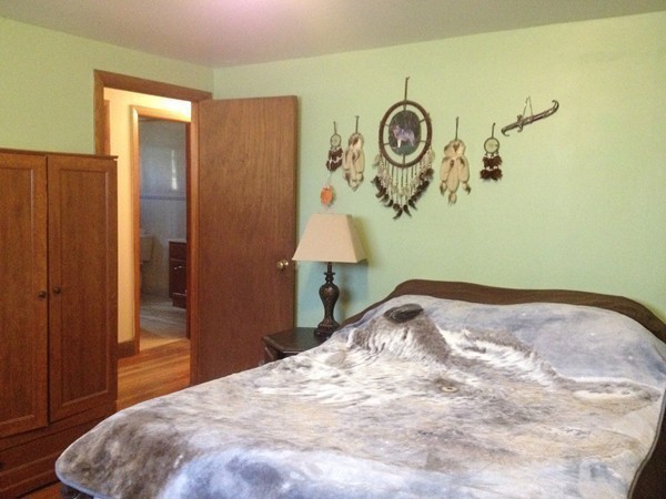 66 West Warren Road Ware, MA 01082 - Photo 14 of 25 a bedroom with a bed and a window