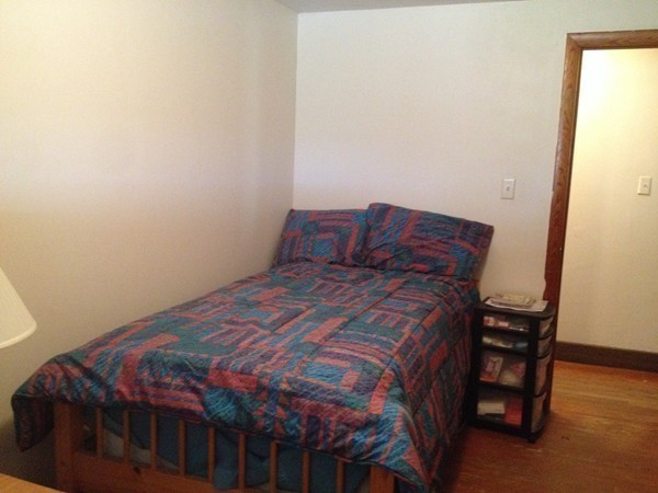 66 West Warren Road Ware, MA 01082 - Photo 16 of 25 a bed sitting in a bedroom next to a window