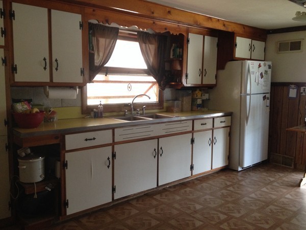 66 West Warren Road Ware, MA 01082 - Photo 6 of 25 a kitchen with a sink a refrigerator and cabinets