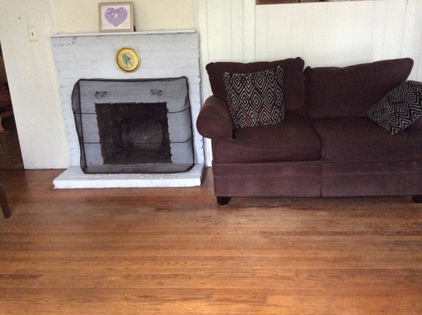 66 West Warren Road Ware, MA 01082 - Photo 9 of 25 a living room with furniture and a fireplace