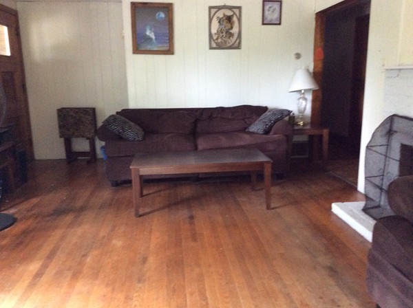 66 West Warren Road Ware, MA 01082 - Photo 10 of 25 a living room with furniture and a fireplace