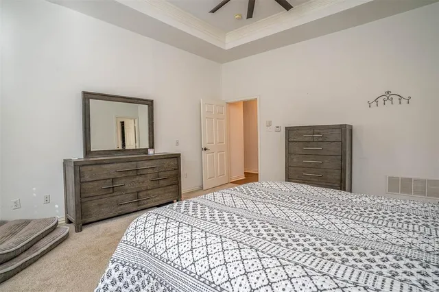 a bedroom with a bed and cabinets
