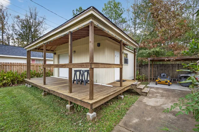 a front view of house with outdoor seating and yard
