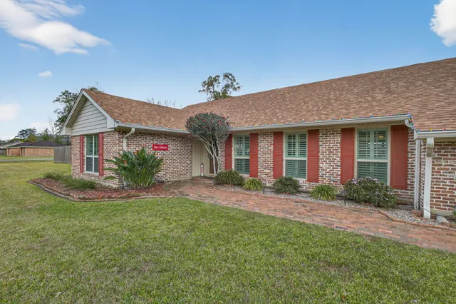 a front view of a house with garden