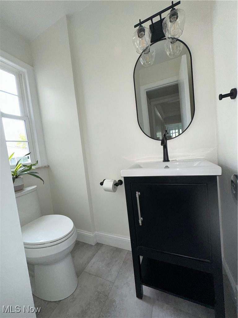 22275 Rye Road Beachwood, OH 44122 - Photo 22 of 39 Bathroom featuring toilet, vanity, baseboards, and tile patterned flooring