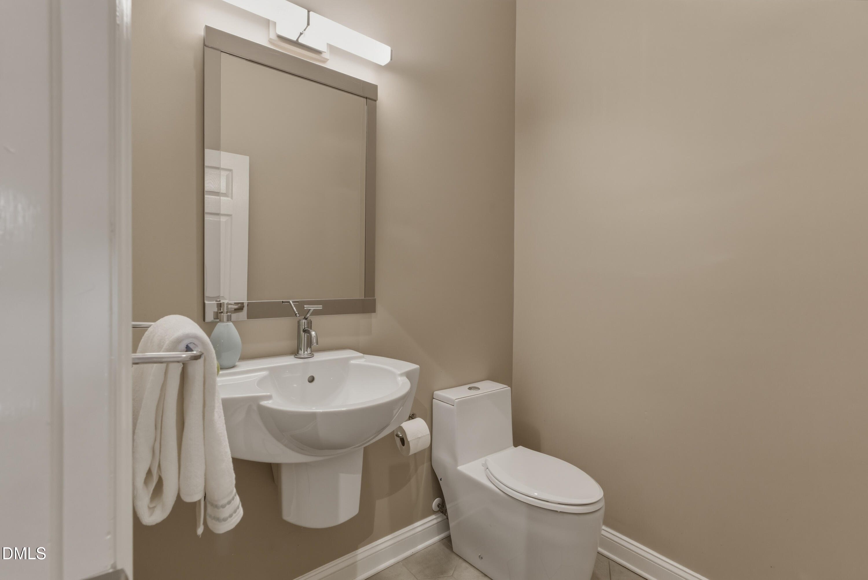 614 Capital Boulevard, Unit 114 Raleigh, NC 27603 - Photo 16 of 33 a white toilet sitting next to a bathroom sink