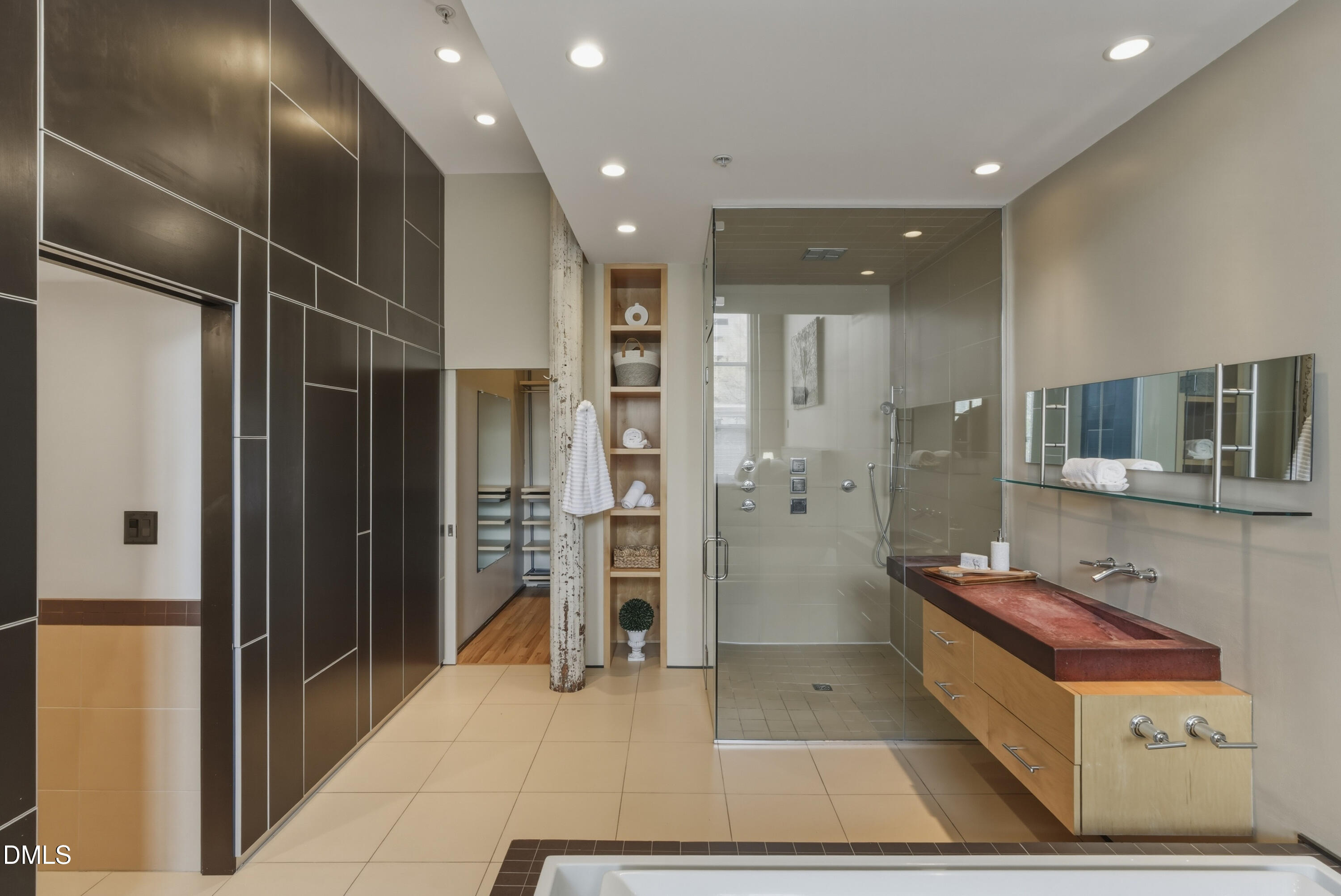 614 Capital Boulevard, Unit 114 Raleigh, NC 27603 - Photo 20 of 33 a bathroom with a glass shower door and a glass door